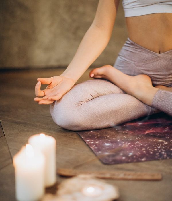 Woman in a calm yoga pose, embodying peace and balance.